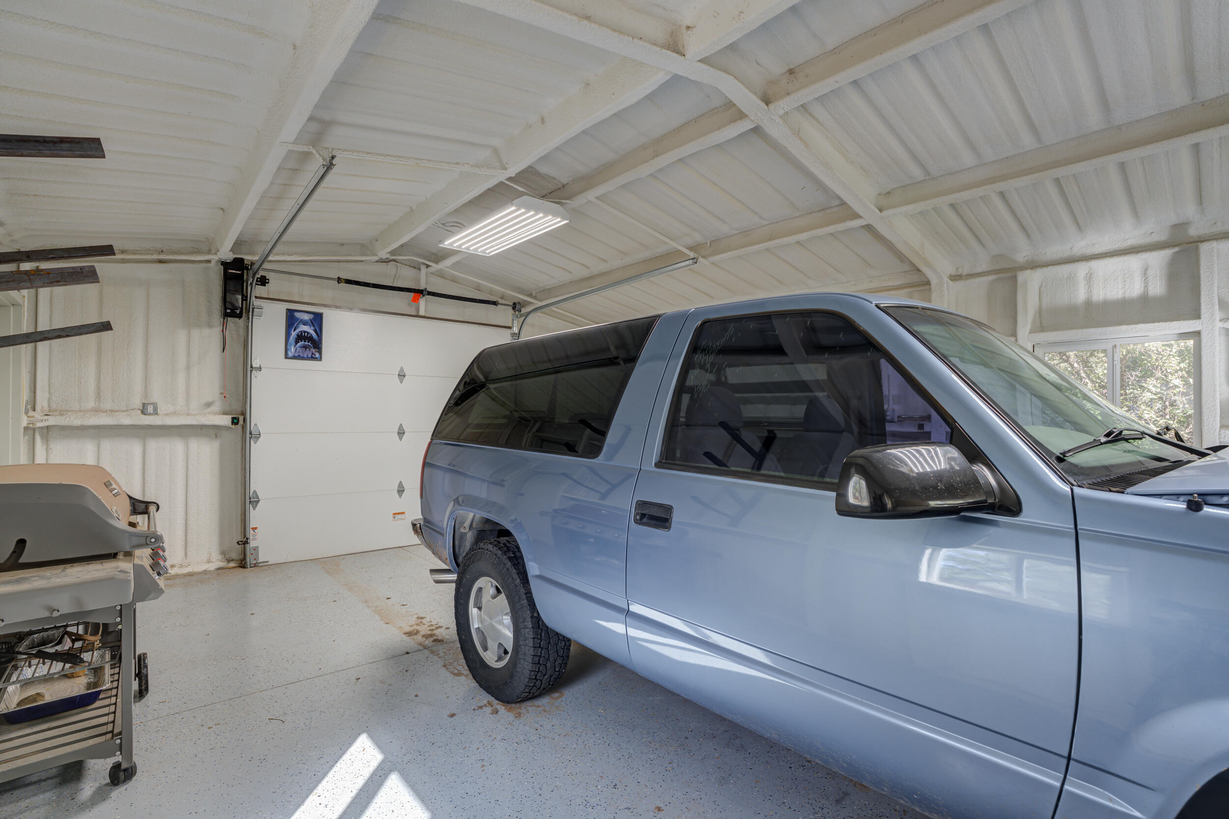 1 Squaw Lane Ransom Canyon, TX 79366 - Photo 61 of 74 a car parked in a garage