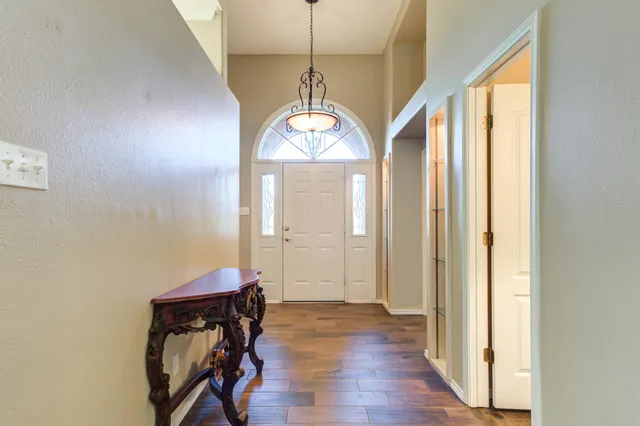 a kitchen with stainless steel appliances granite countertop a stove and a refrigerator