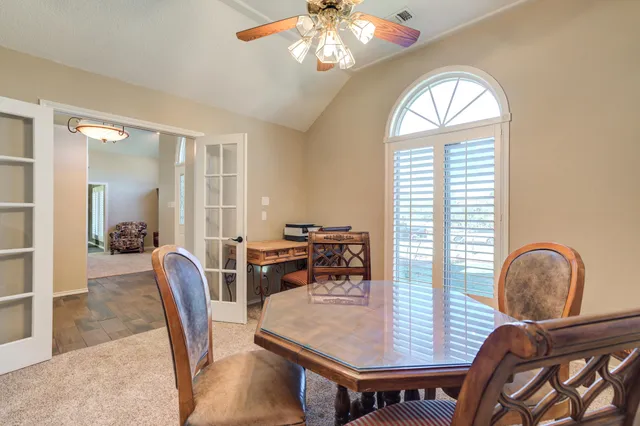 a kitchen with granite countertop cabinets stainless steel appliances and white cabinets