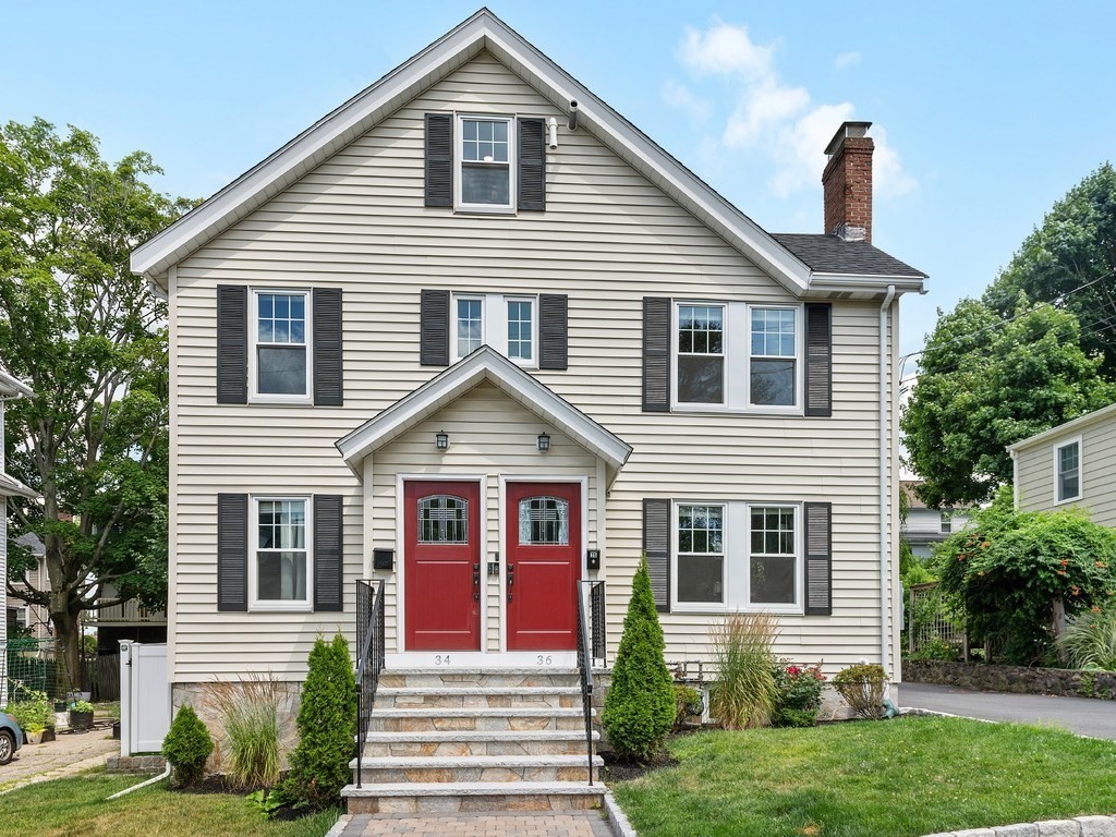 34 Watson Road, Unit 34 Belmont, MA 02478 - Photo 1 of 26 a front view of a house with a yard