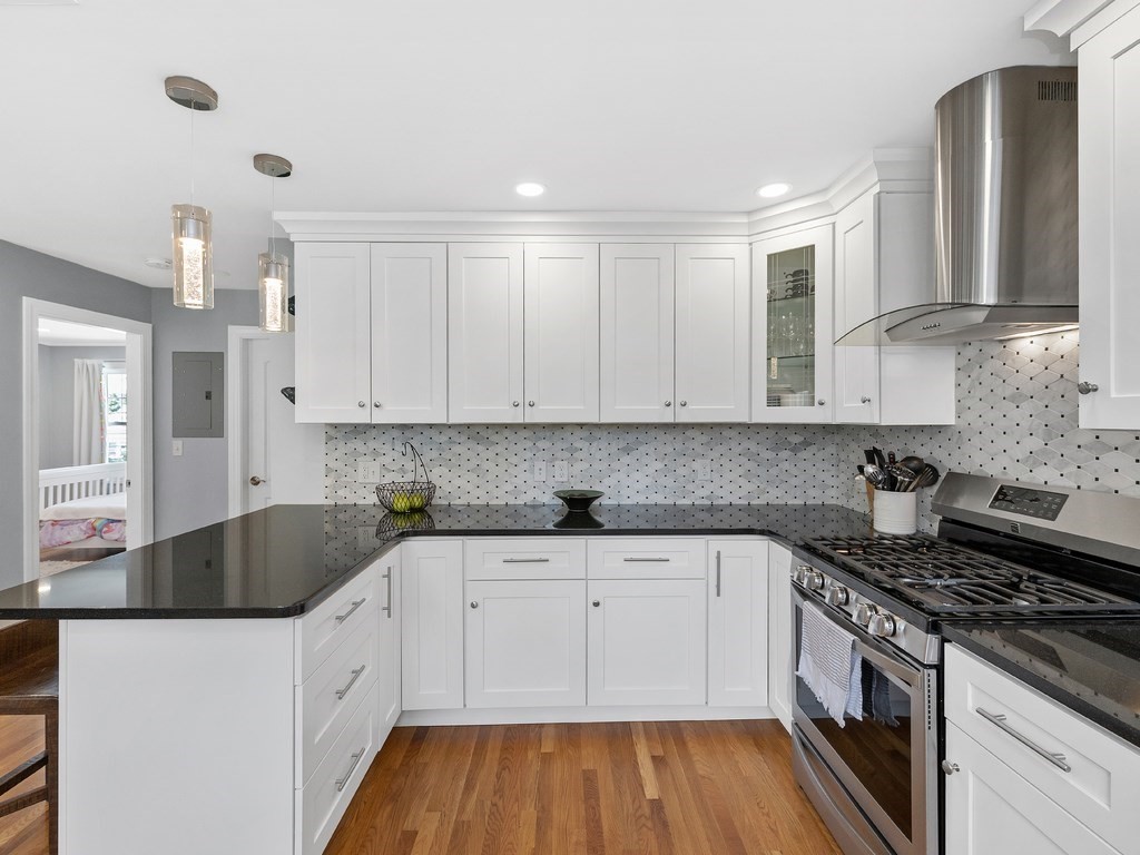 34 Watson Road, Unit 34 Belmont, MA 02478 - Photo 11 of 26 a kitchen with granite countertop a sink and cabinets