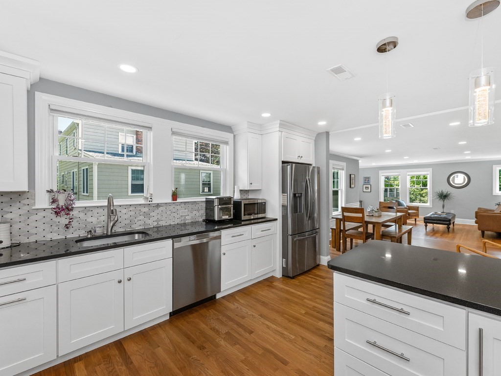 34 Watson Road, Unit 34 Belmont, MA 02478 - Photo 12 of 26 a large kitchen with a large counter top appliances and cabinets