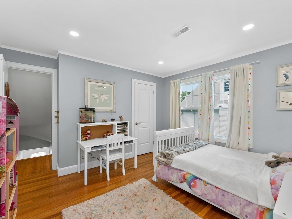 34 Watson Road, Unit 34 Belmont, MA 02478 - Photo 16 of 26 a bedroom with furniture and a wooden floor