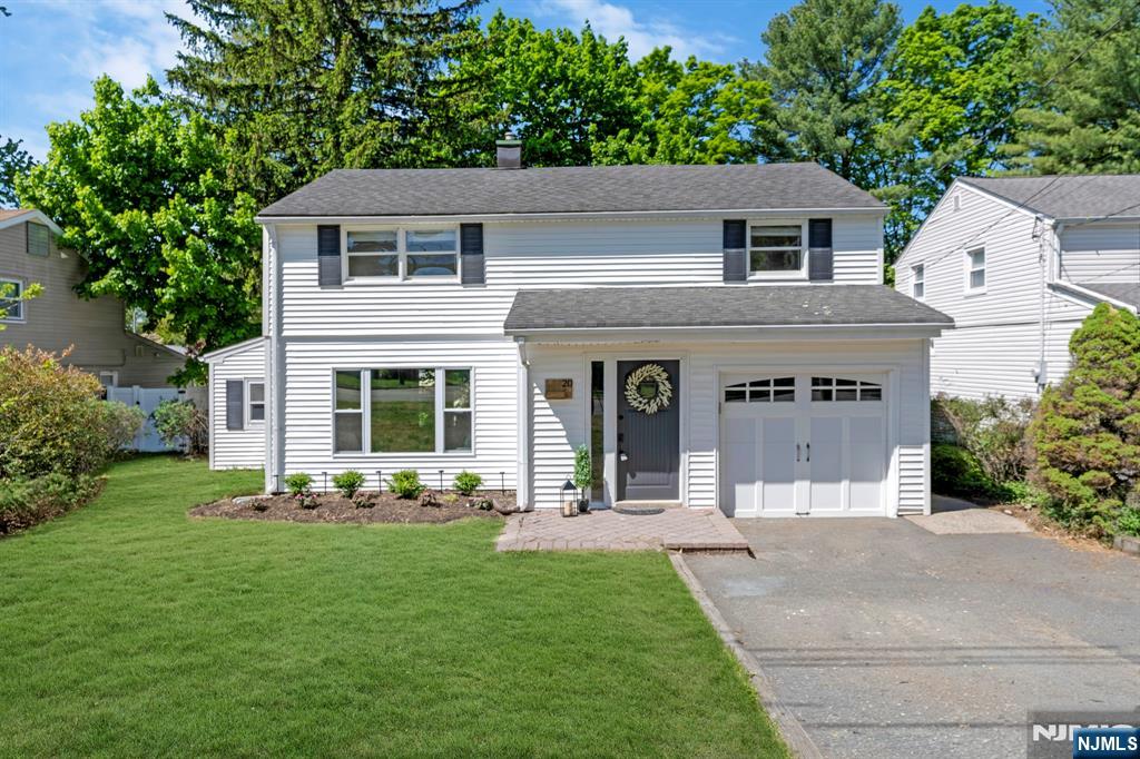 20 West Saddle River Road Waldwick, NJ 07463 - Photo 2 of 39 a front view of a house with garden