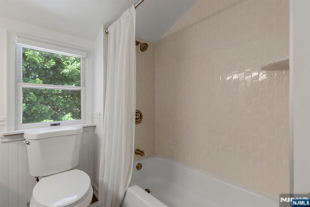 20 West Saddle River Road Waldwick, NJ 07463 - Photo 29 of 39 a white toilet sitting next to a bath tub