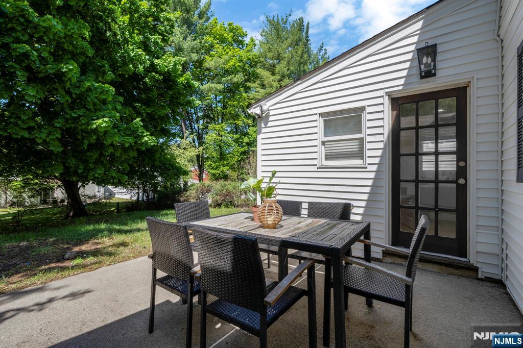 20 West Saddle River Road Waldwick, NJ 07463 - Photo 36 of 39 a view of a patio with a table and chairs
