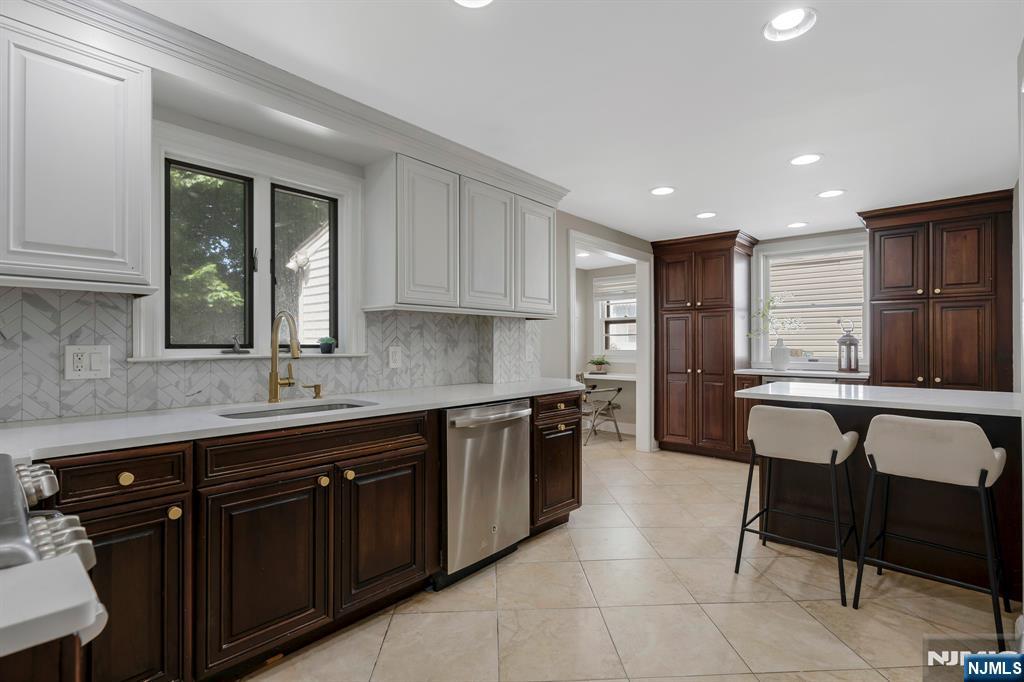 20 West Saddle River Road Waldwick, NJ 07463 - Photo 5 of 39 a kitchen with a sink cabinets and window
