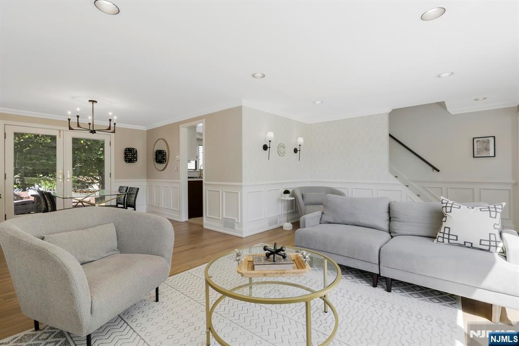 20 West Saddle River Road Waldwick, NJ 07463 - Photo 7 of 39 a living room with furniture kitchen view and a chandelier