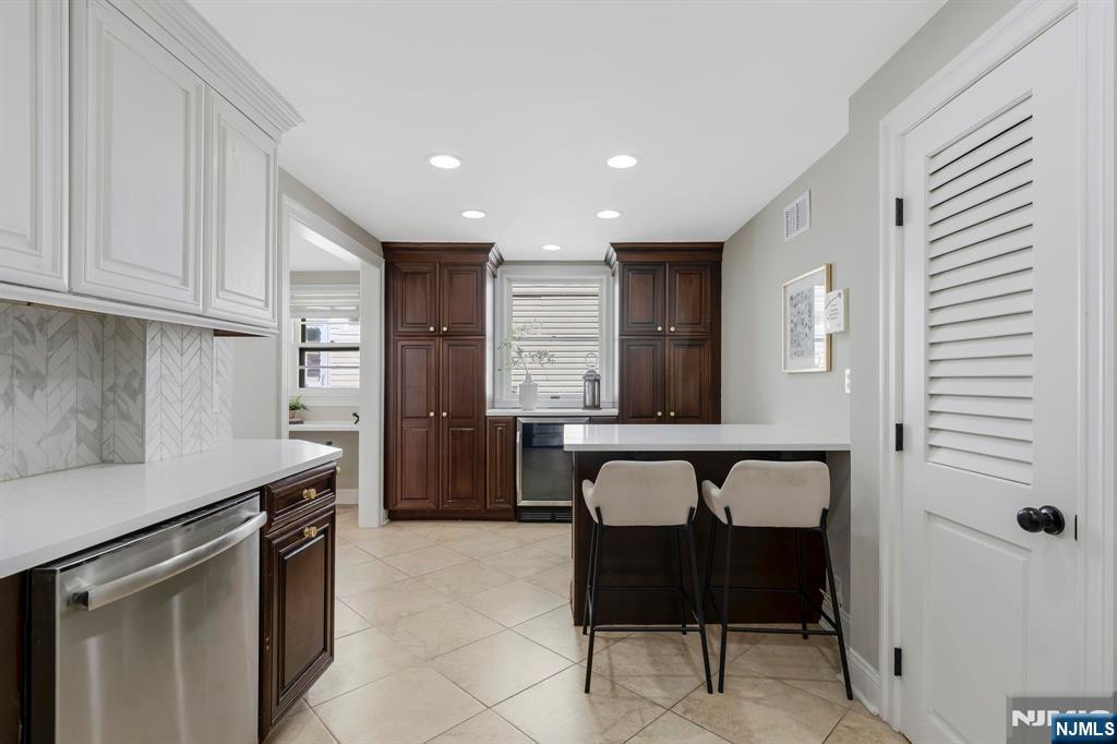 20 West Saddle River Road Waldwick, NJ 07463 - Photo 9 of 39 a kitchen with a table and chairs in it