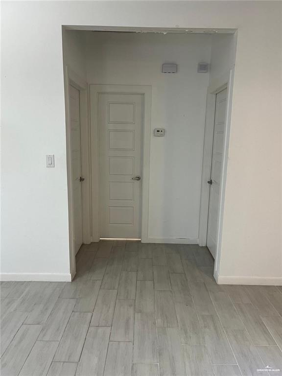 1624 West Marlin Street, Unit 2 Pharr, TX 78577 - Photo 5 of 12 an empty room with a bench