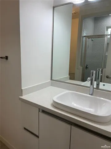 a bathroom with a sink and a mirror