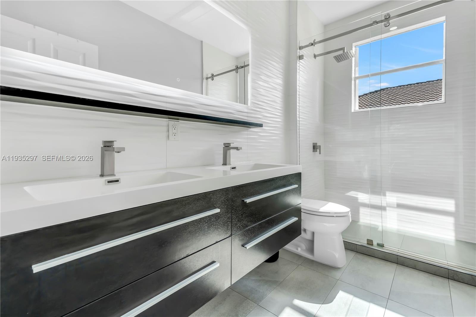 5311 Southwest 184th Way Miramar, FL 33029 - Photo 41 of 81 a bathroom with a sink a toilet and a bathtub