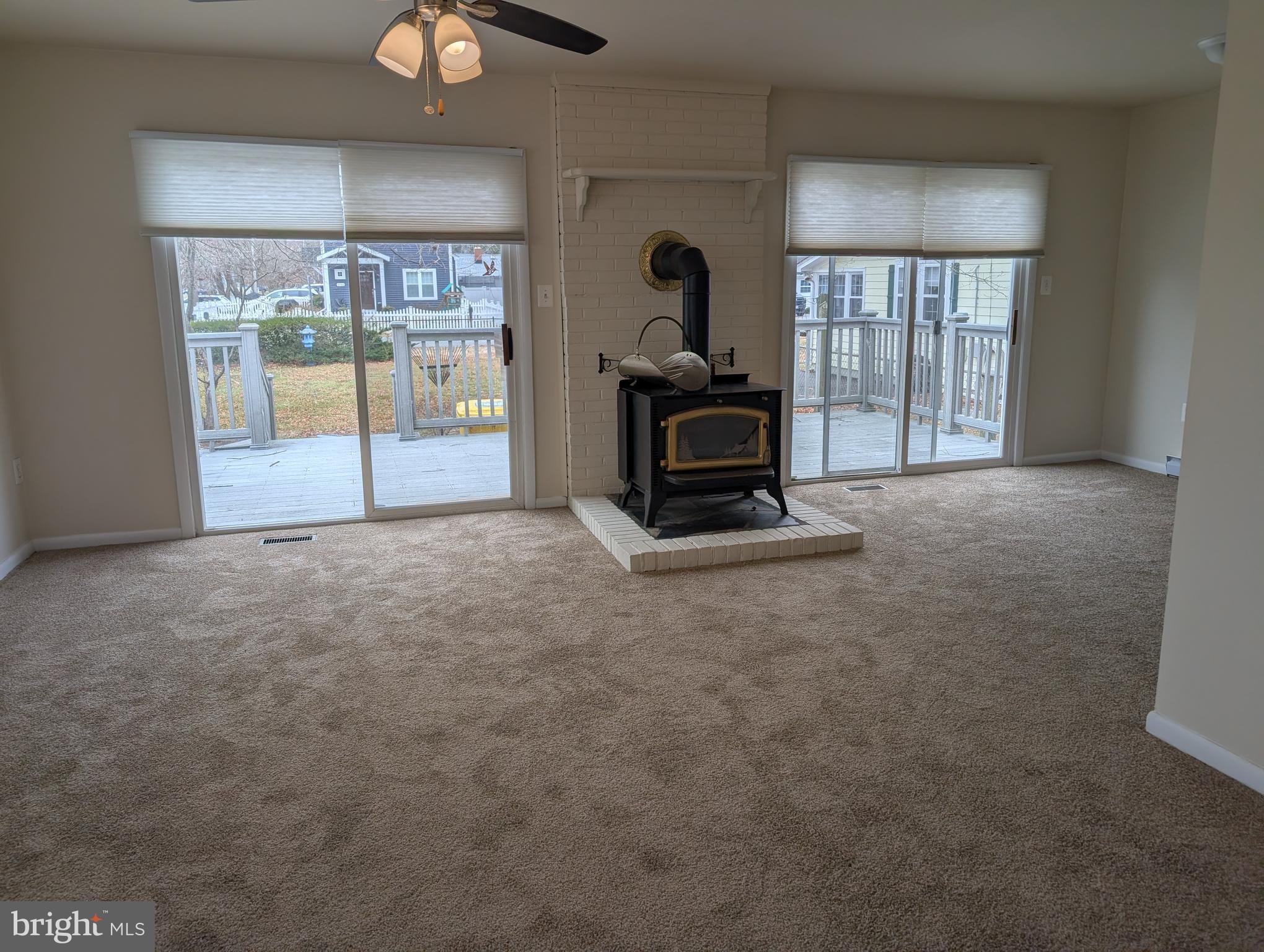 5535 Gloucester Street Churchton, MD 20733 - Photo 2 of 10 a living room with furniture and a fireplace