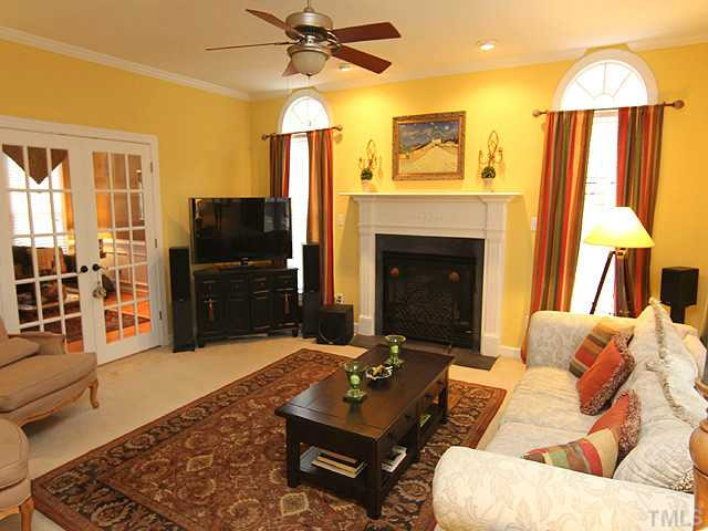 2809 Dray Court Raleigh, NC 27613 - Photo 2 of 13 Great entertaining plan. This beautiful family rooms opens to the kitchen and the formal living/study. Gas log fireplace, french doors, crown molding, ceiling fan, and fantastic views of the expansive back yard! Den/Family/Great Room