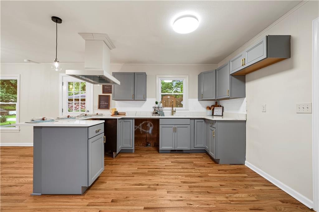 23 East Camelia Road Northeast Rome, GA 30161 - Photo 6 of 27 a kitchen with stainless steel appliances granite countertop a sink a stove and a wooden floors