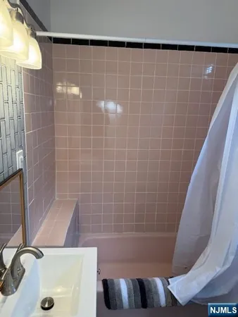 a bathroom with a sink and a shower