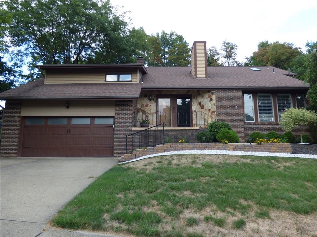102 Downing Drive Coraopolis, PA 15108 - Photo 1 of 25 a front view of a house with a yard
