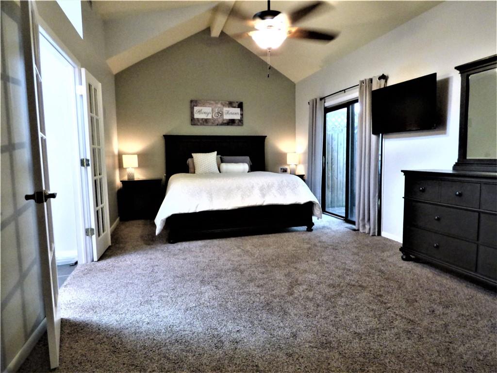 102 Downing Drive Coraopolis, PA 15108 - Photo 13 of 25 a spacious bedroom with a bed and a flat screen tv