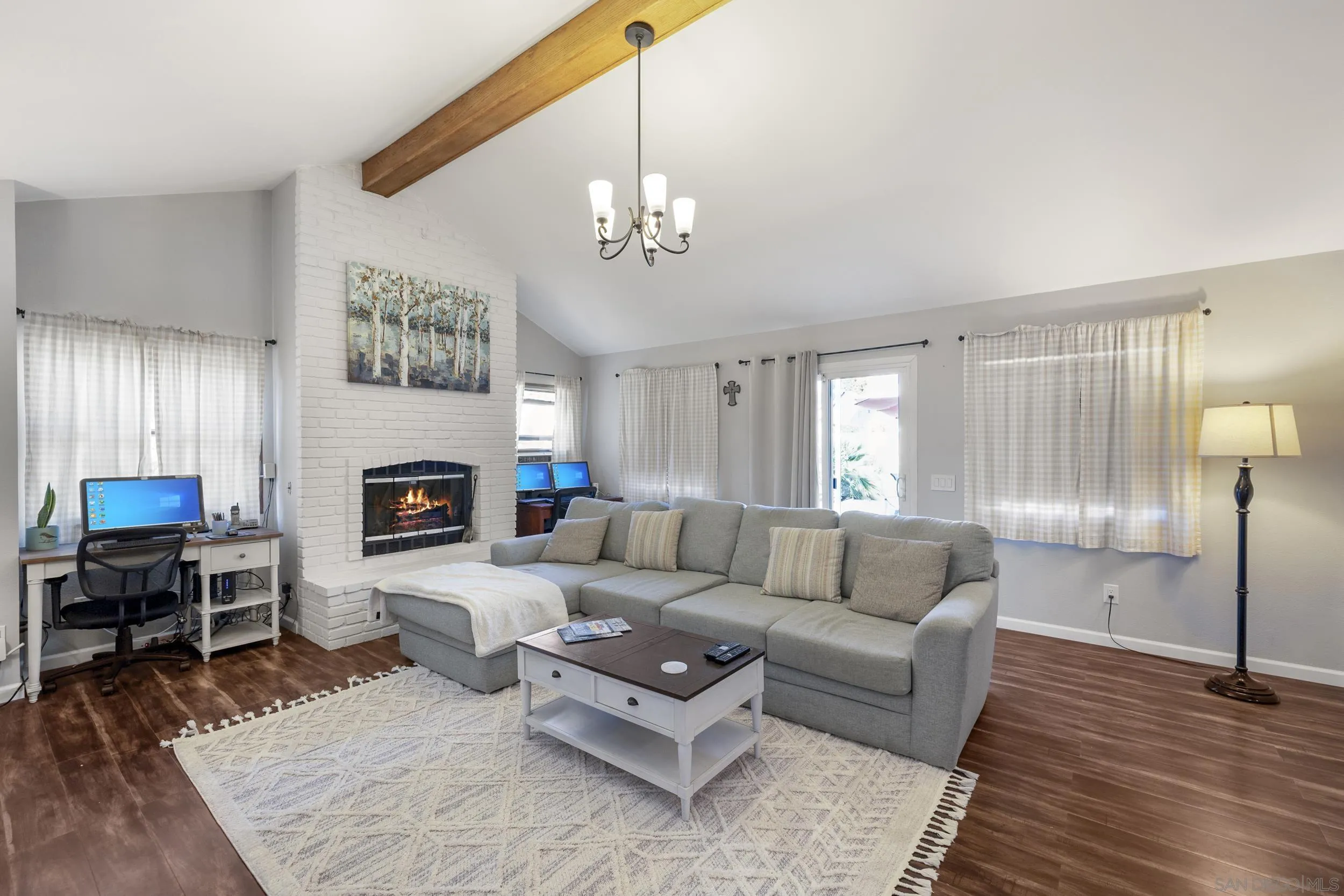4652 Briar Ridge Road Oceanside, CA 92056 - Photo 13 of 34 a living room with furniture a fireplace and a table