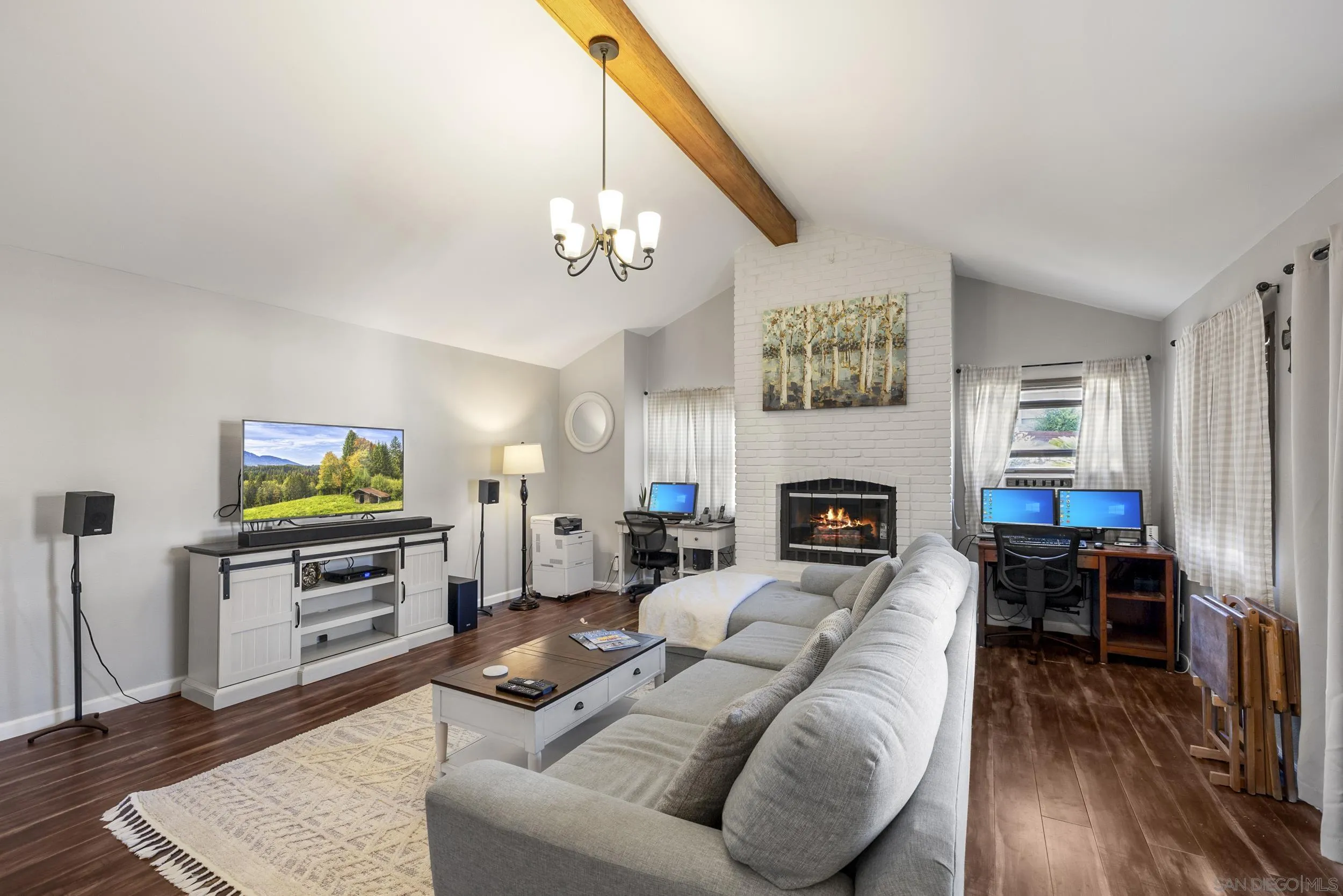 4652 Briar Ridge Road Oceanside, CA 92056 - Photo 14 of 34 a living room with furniture a fireplace and a flat screen tv