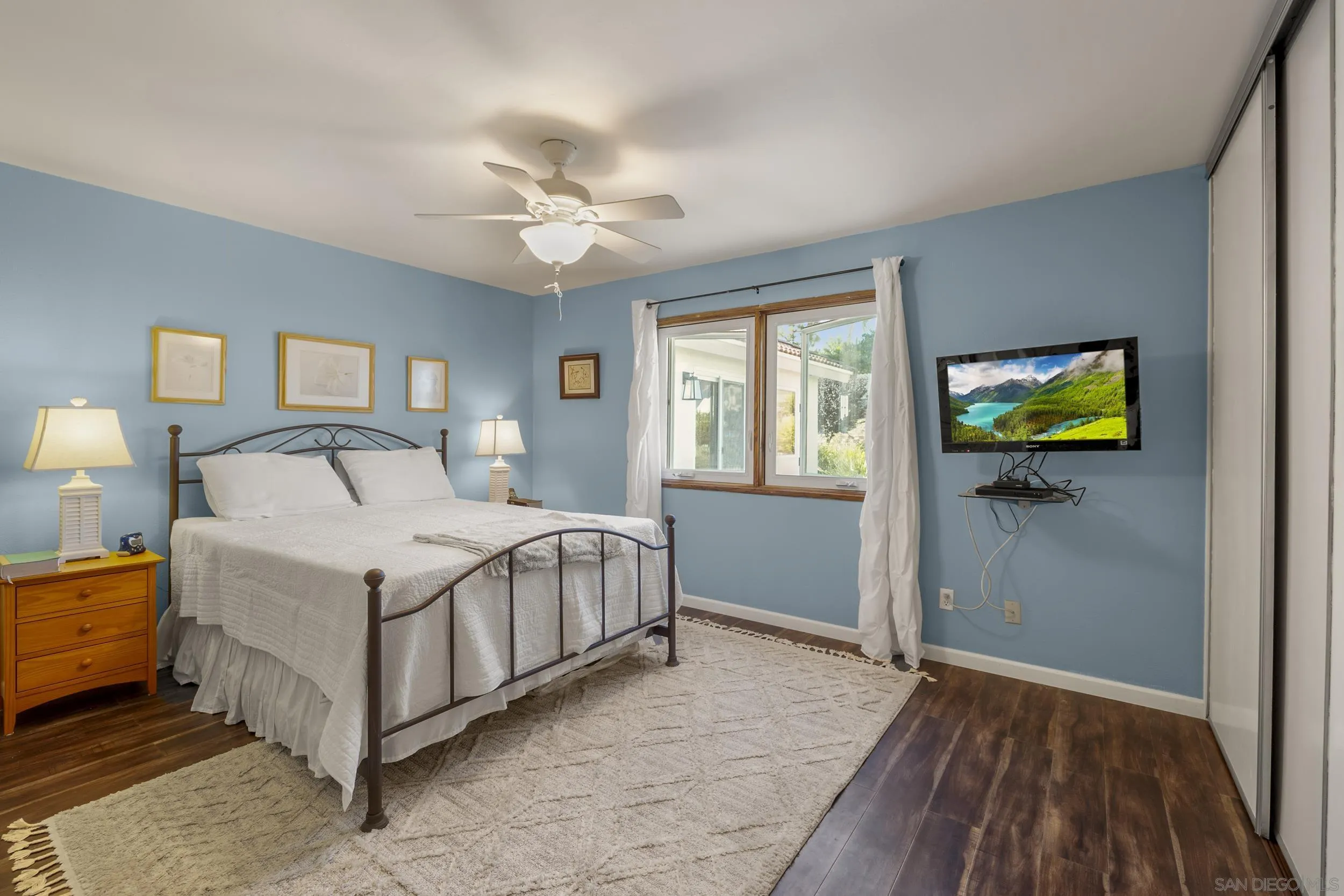 4652 Briar Ridge Road Oceanside, CA 92056 - Photo 16 of 34 a bedroom with a bed and a window