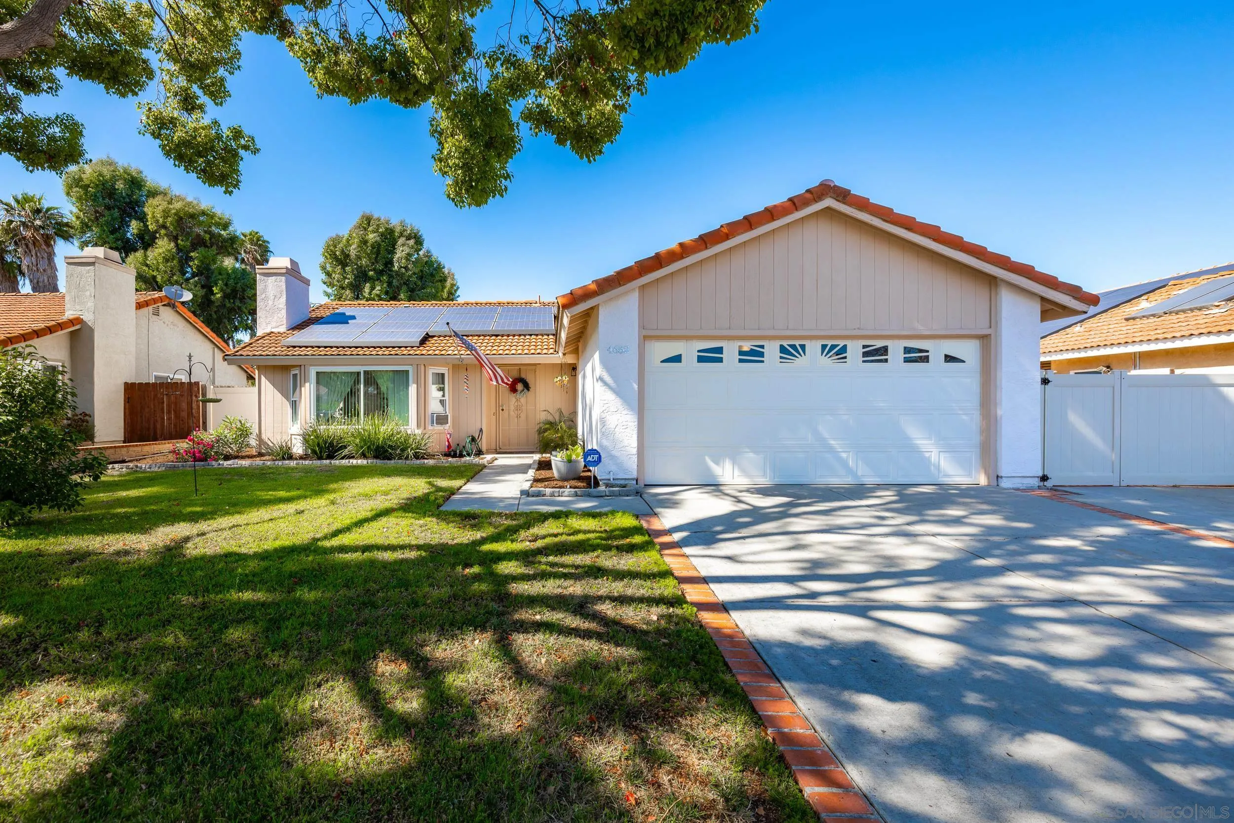 4652 Briar Ridge Road Oceanside, CA 92056 - Photo 2 of 34 a front view of a house with a yard