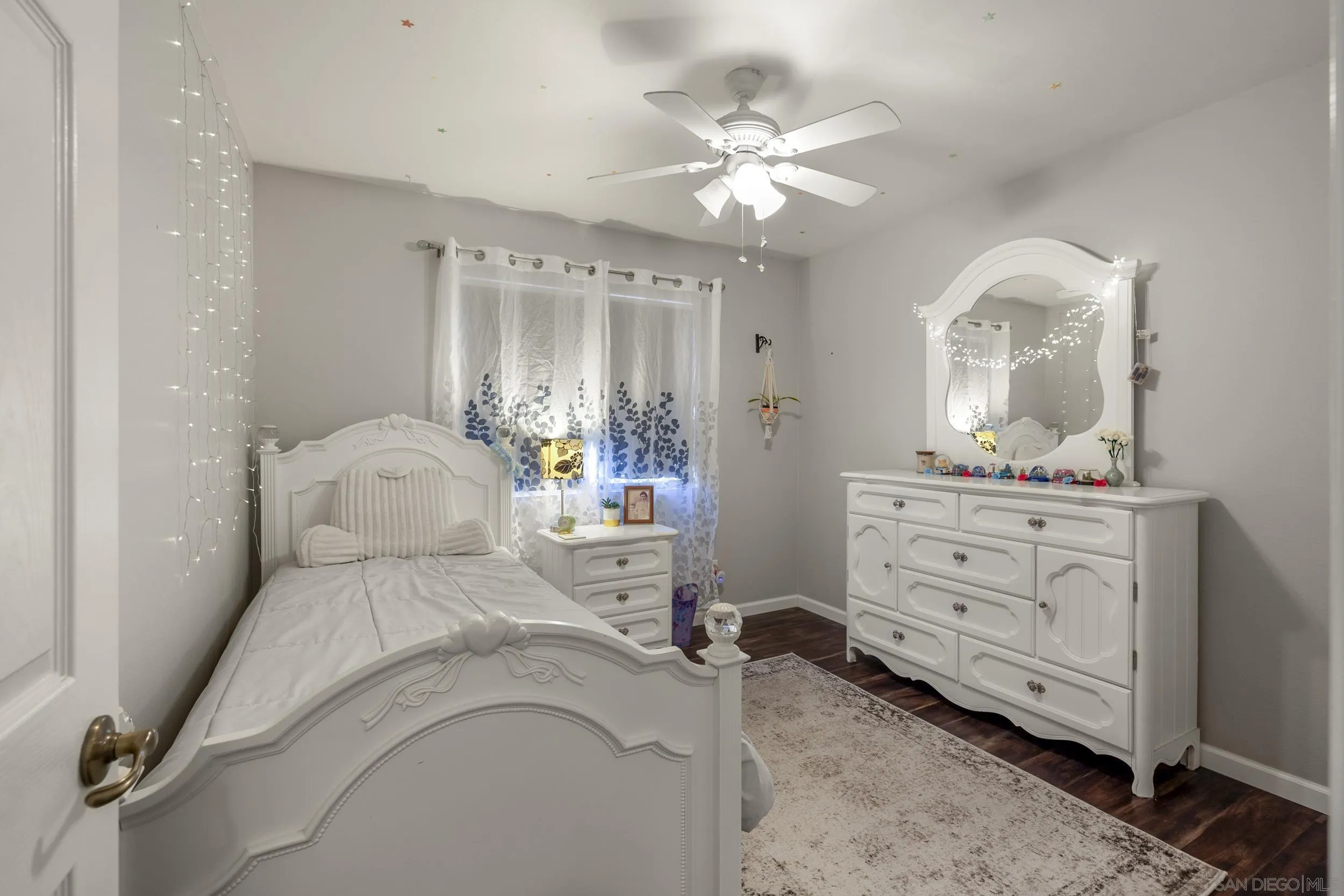 4652 Briar Ridge Road Oceanside, CA 92056 - Photo 21 of 34 a bedroom with a bed and a mirror