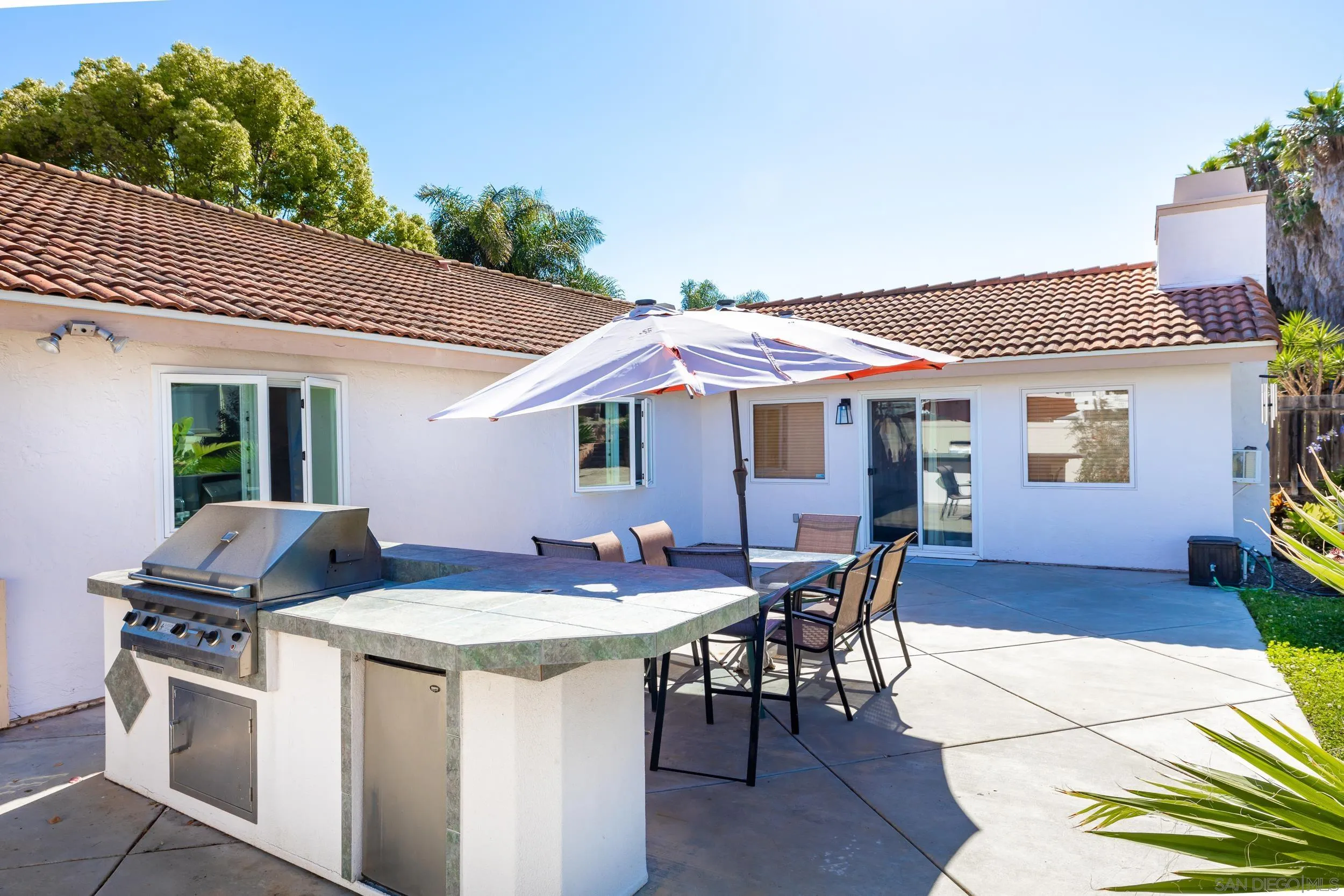 4652 Briar Ridge Road Oceanside, CA 92056 - Photo 22 of 34 a view of a patio with table and chairs