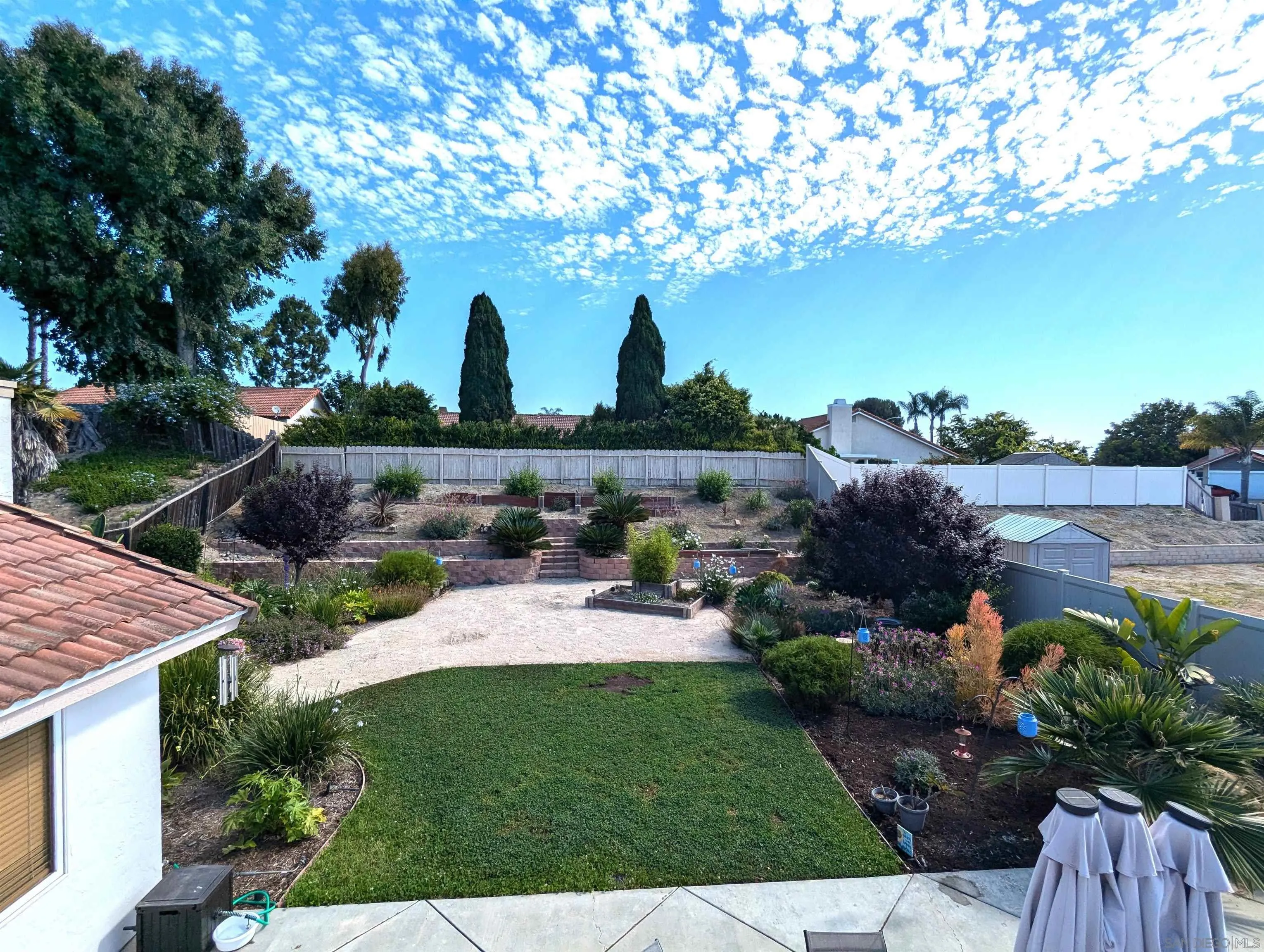 4652 Briar Ridge Road Oceanside, CA 92056 - Photo 29 of 34 a view of a backyard with sitting area