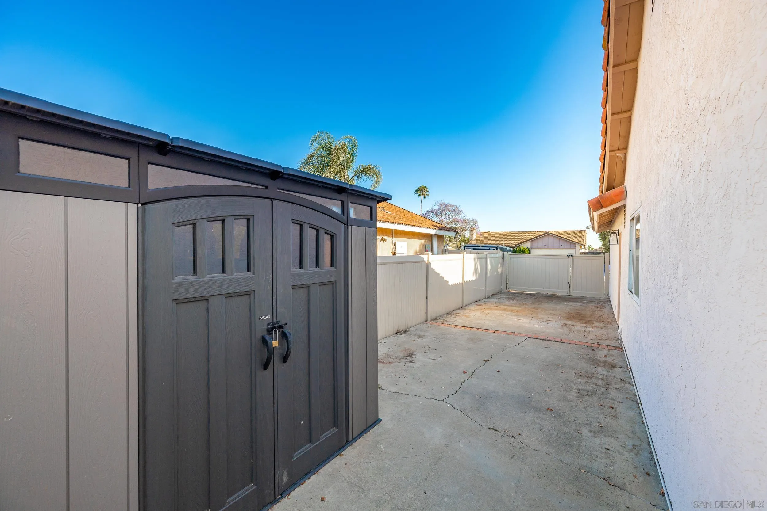 4652 Briar Ridge Road Oceanside, CA 92056 - Photo 30 of 34 a view of a house with a backyard