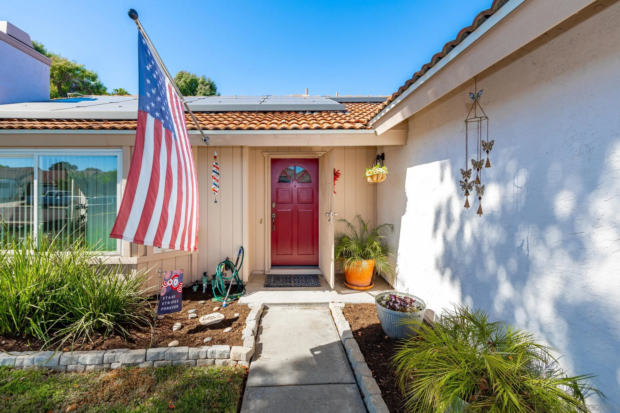 4652 Briar Ridge Road Oceanside, CA 92056 - Photo 3 of 34 a front view of a house with a porch