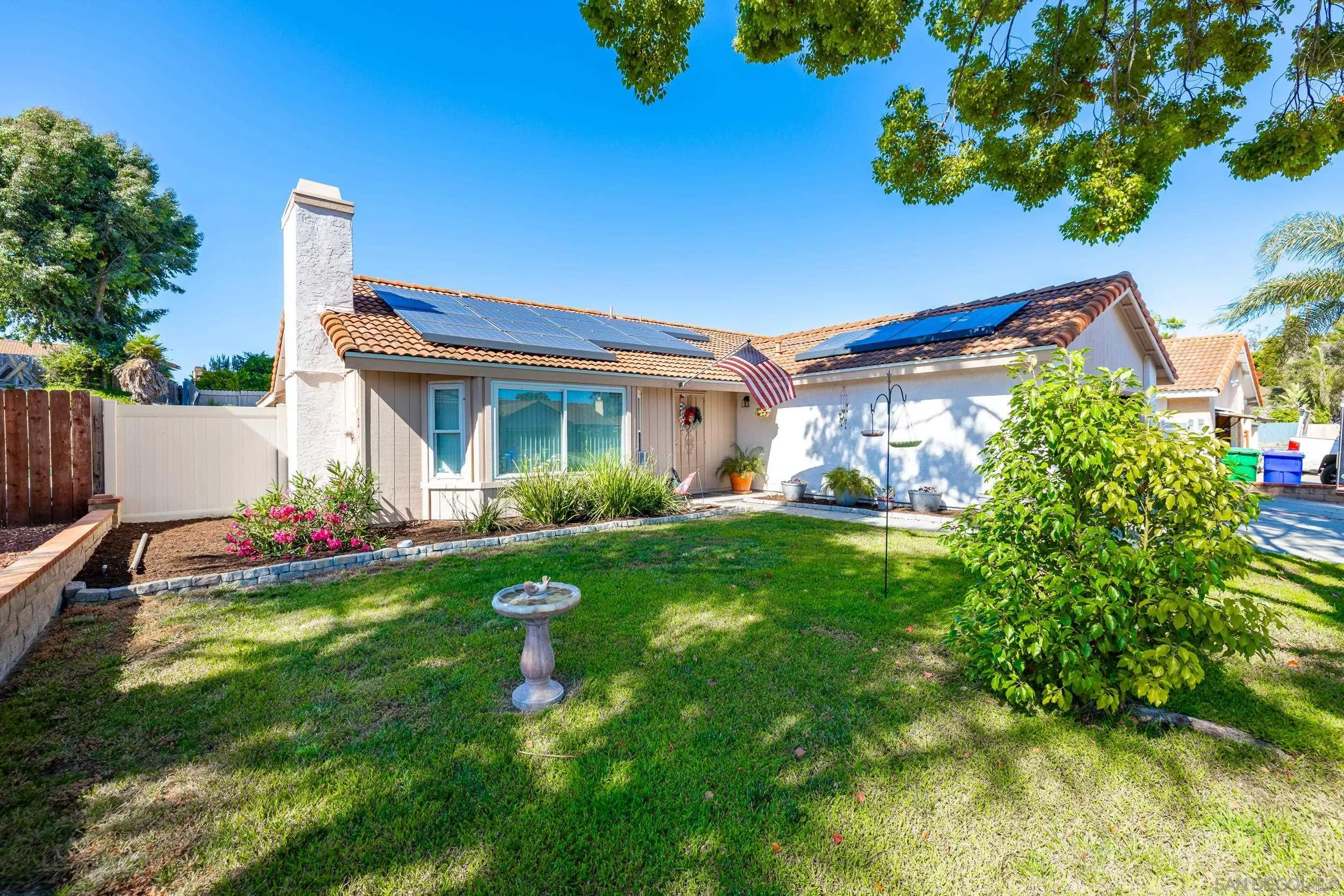 4652 Briar Ridge Road Oceanside, CA 92056 - Photo 32 of 34 a view of an house with backyard and a tree