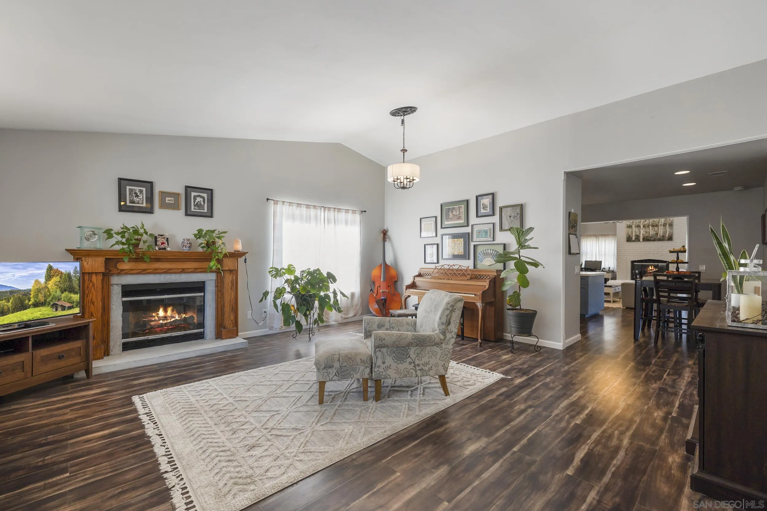 4652 Briar Ridge Road Oceanside, CA 92056 - Photo 4 of 34 a living room with furniture and a fireplace