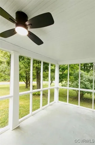 a view of an empty room with a balcony
