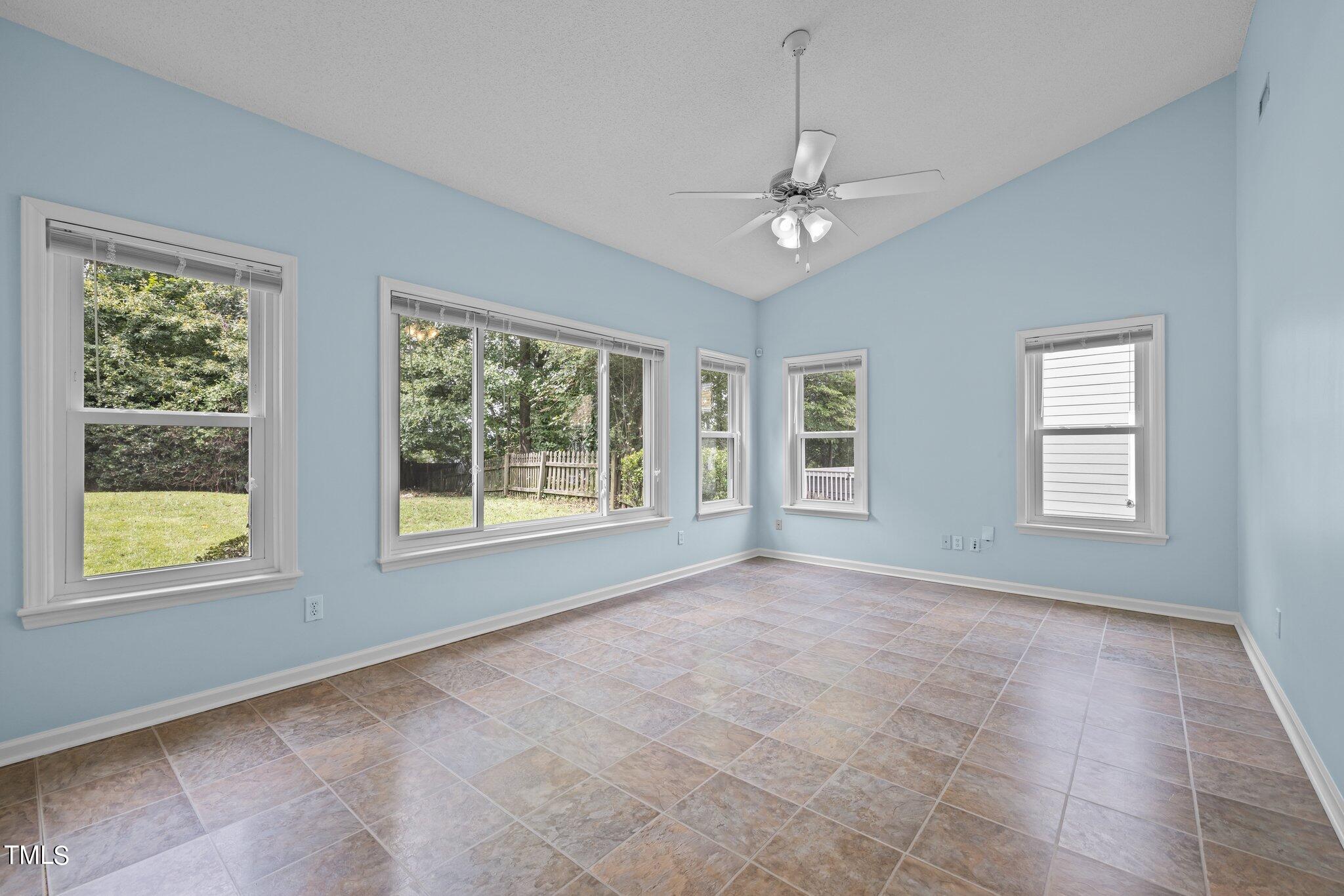 9421 Tweeds Mill Road Raleigh, NC 27617 - Photo 16 of 33 a view of an empty room with a window
