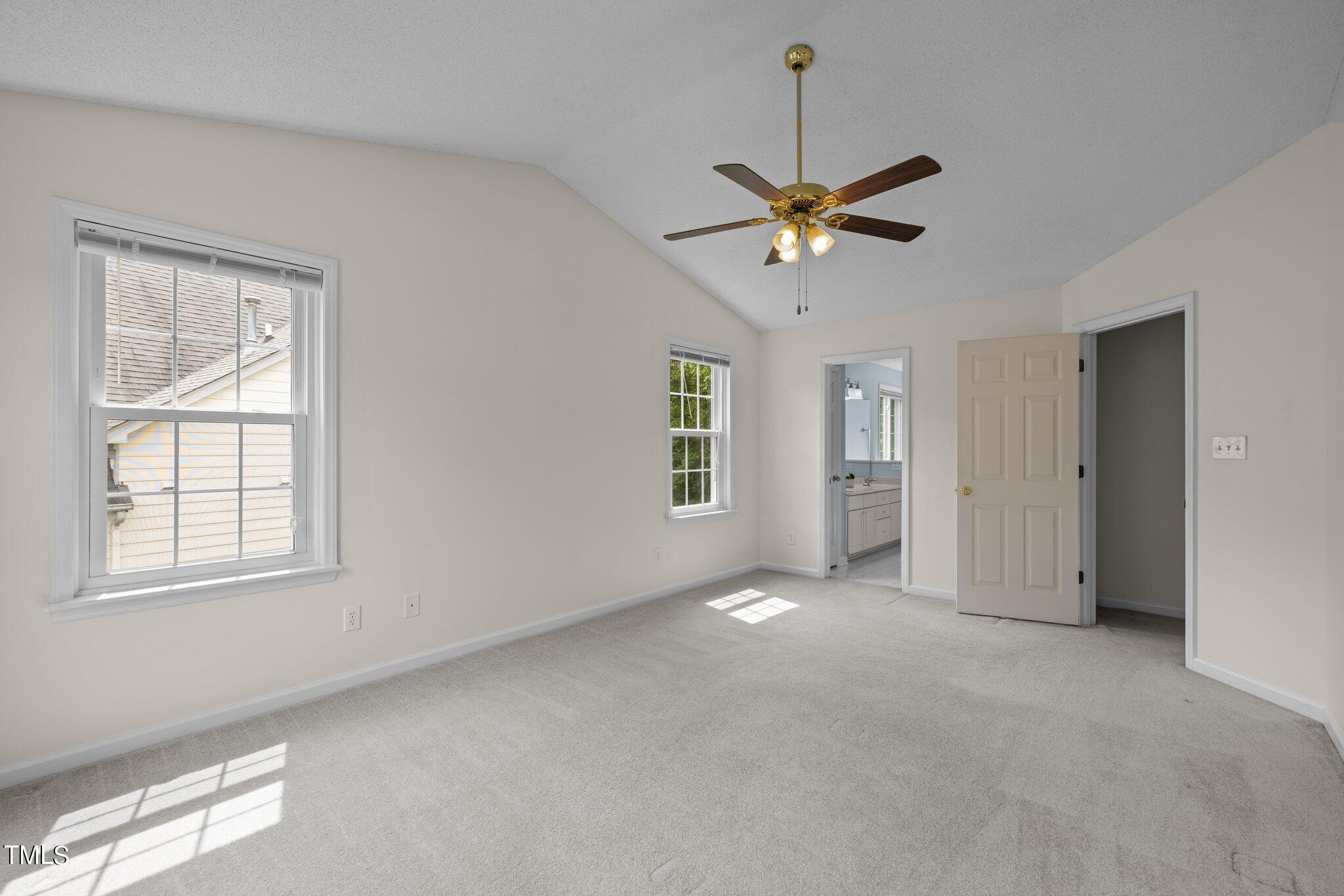 9421 Tweeds Mill Road Raleigh, NC 27617 - Photo 19 of 33 a view of an empty room with a window