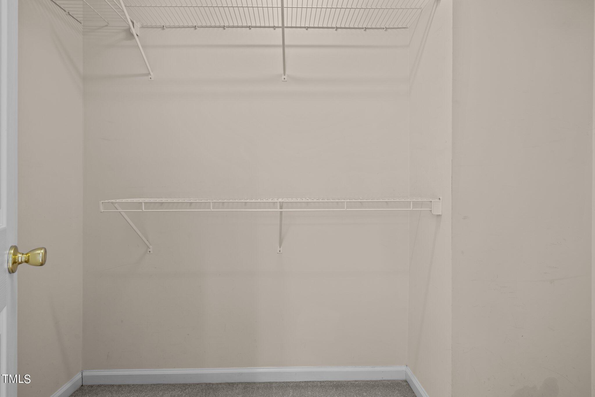 9421 Tweeds Mill Road Raleigh, NC 27617 - Photo 23 of 33 a view of small space with racks on the wall