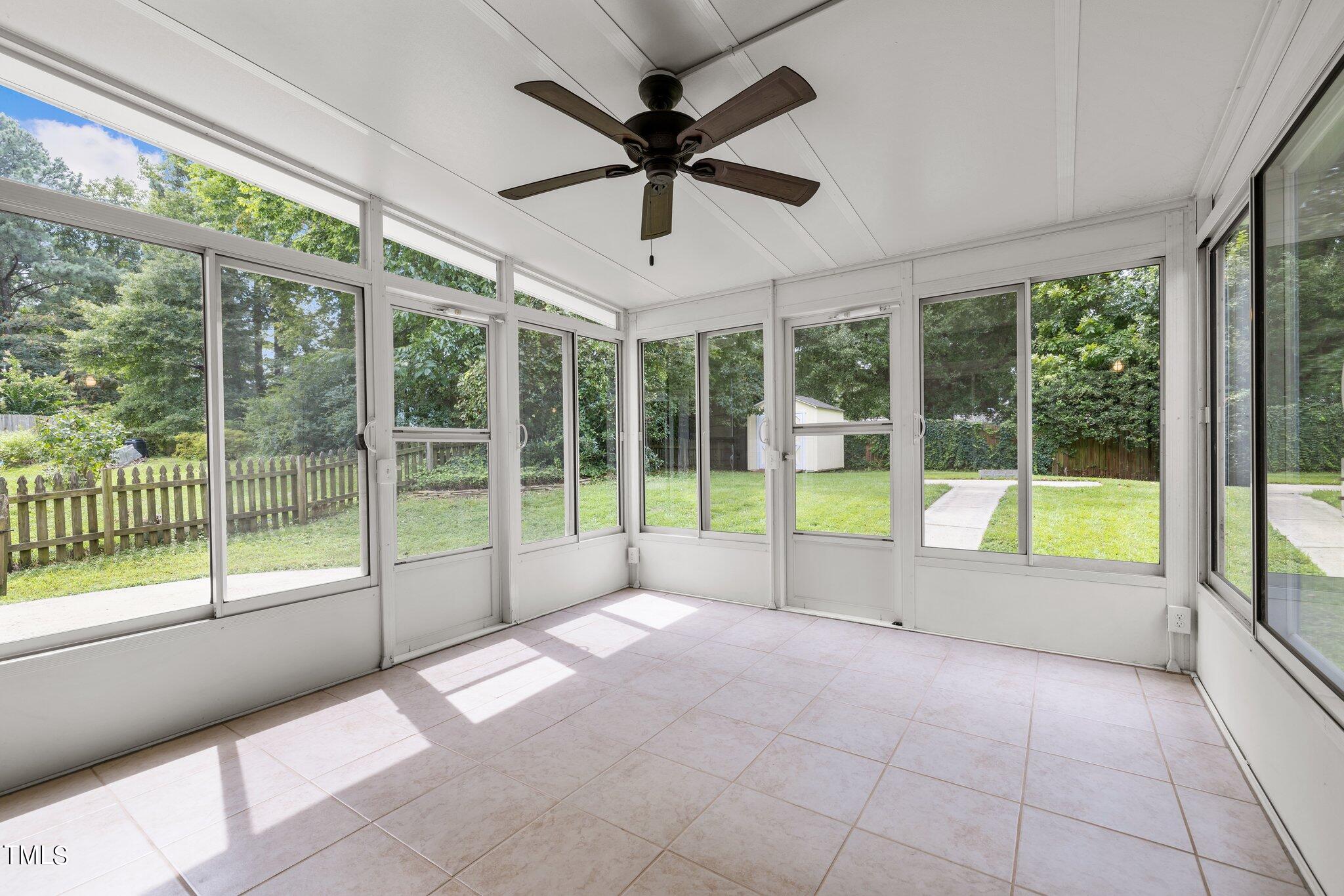 9421 Tweeds Mill Road Raleigh, NC 27617 - Photo 28 of 33 a view of an empty room with windows