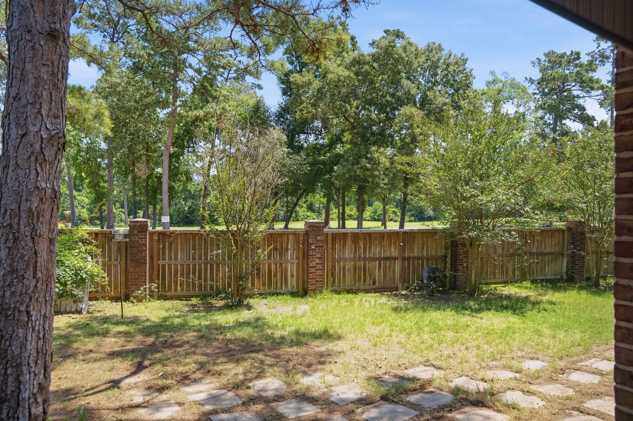 25014 Northampton Terrace Drive Spring, TX 77389 - Photo 35 of 41 View from the back patio where you can see the beautiful trees from the golf course on the other side of street. No back neighbors