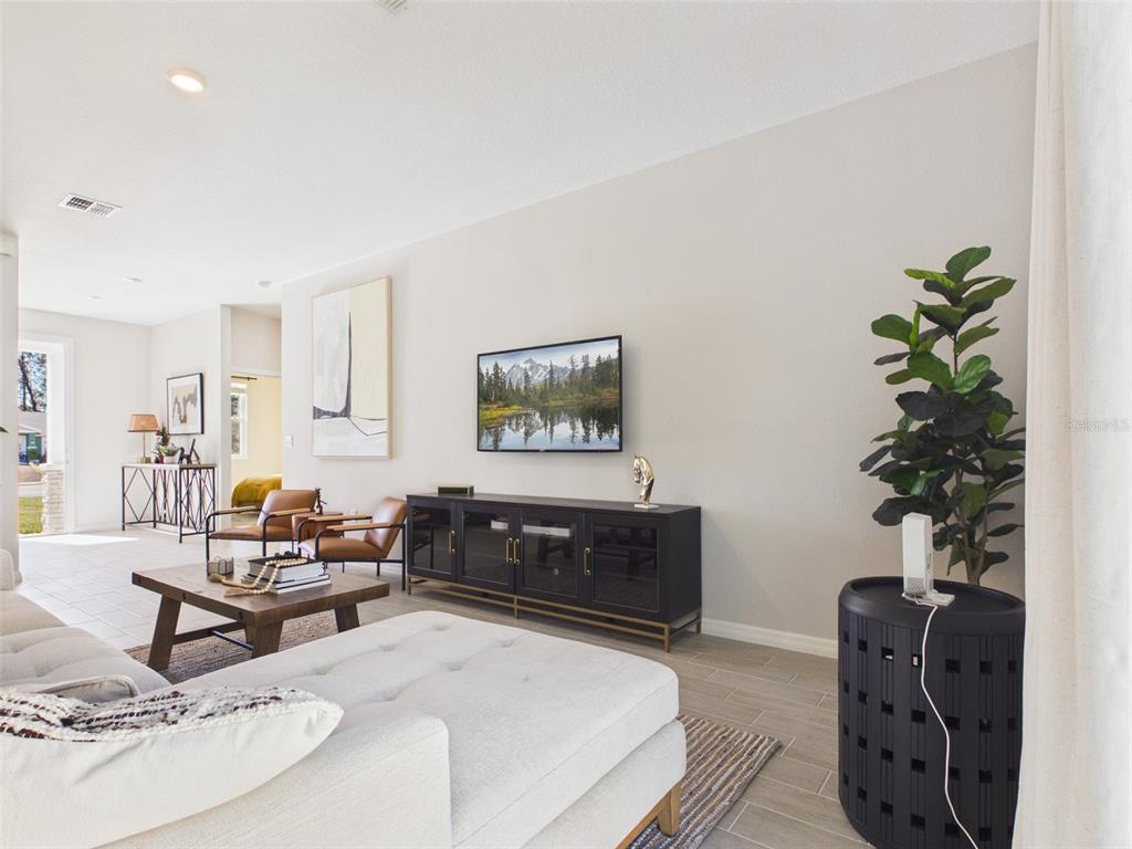 8499 North Inca Way Dunnellon, FL 34434 - Photo 10 of 35 a living room with furniture flowerpot and a potted plant