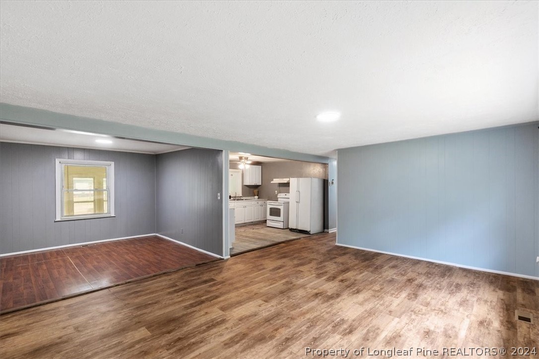 650 McKay Drive Spring Lake, NC 28390 - Photo 11 of 37 a view of empty room with wooden floor