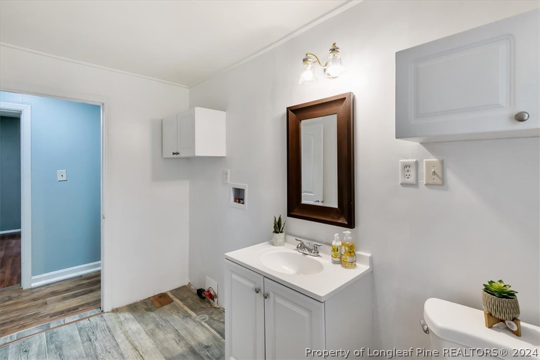 650 McKay Drive Spring Lake, NC 28390 - Photo 16 of 37 a bathroom with a sink and a mirror