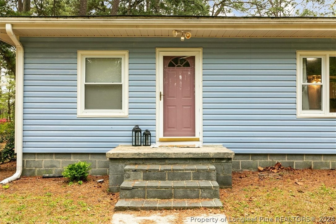650 McKay Drive Spring Lake, NC 28390 - Photo 2 of 37 a view of front door and potted plants