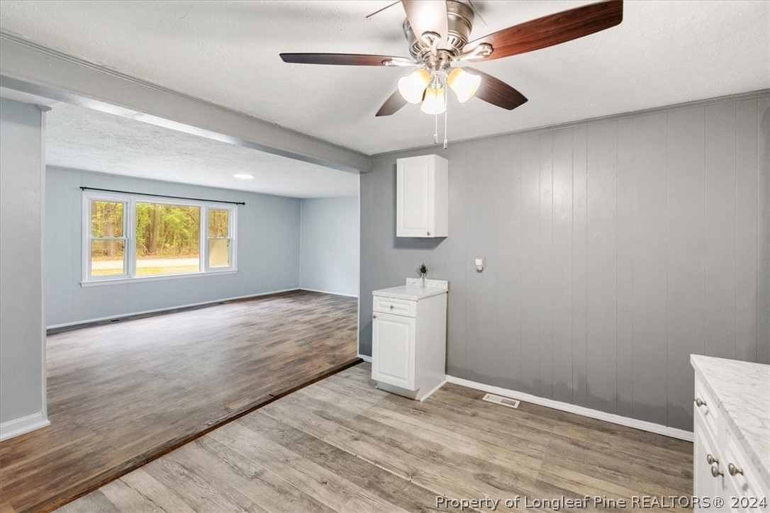 650 McKay Drive Spring Lake, NC 28390 - Photo 29 of 37 wooden floor in an empty room with a window