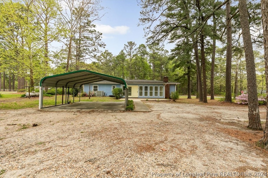 650 McKay Drive Spring Lake, NC 28390 - Photo 34 of 37 a front view of a house with a garden