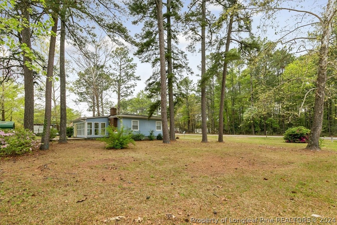 650 McKay Drive Spring Lake, NC 28390 - Photo 5 of 37 a backyard of a house with lots of green space