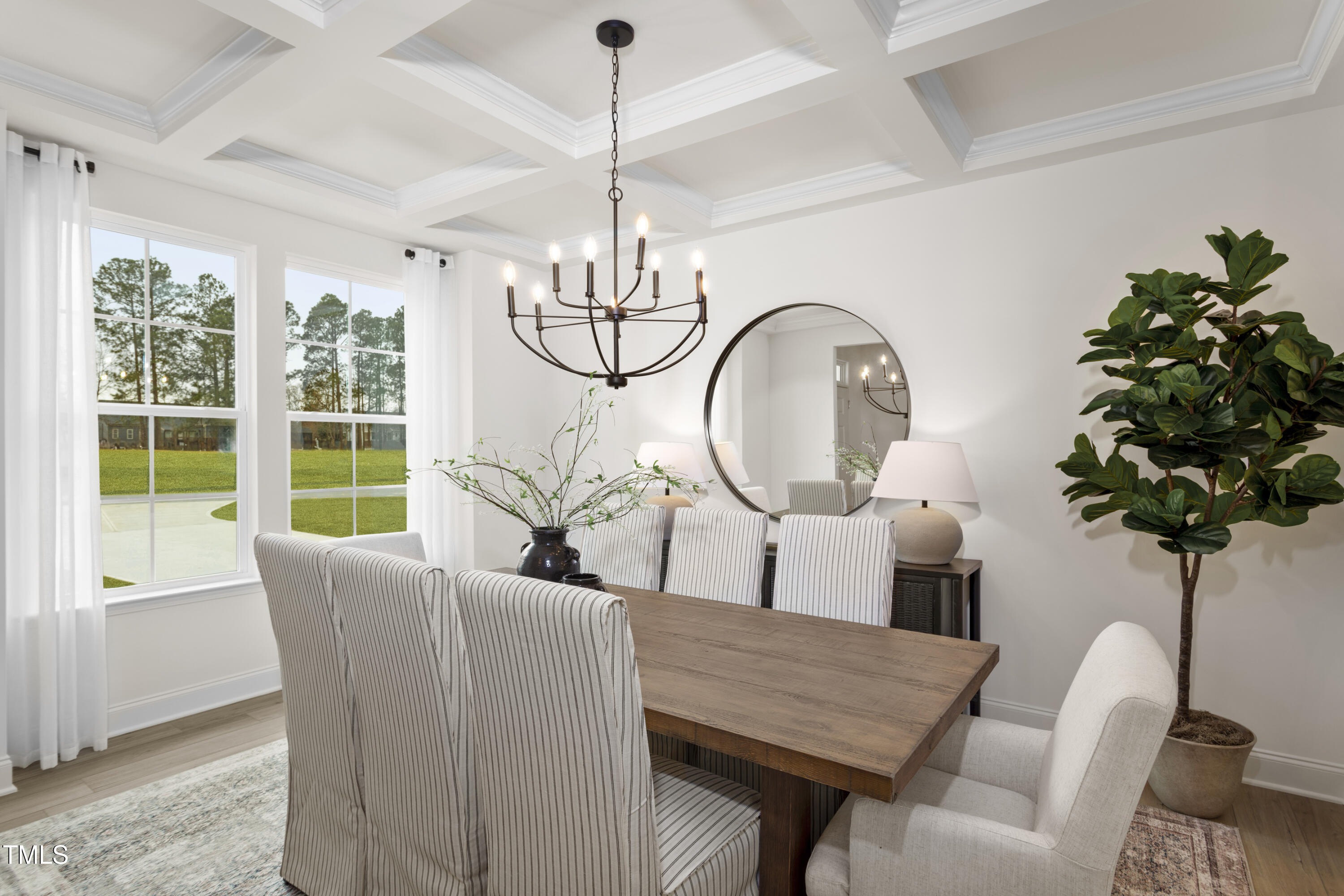 315 Adams Pointe Court Angier, NC 27501 - Photo 5 of 25 a living room with furniture a chandelier and a window