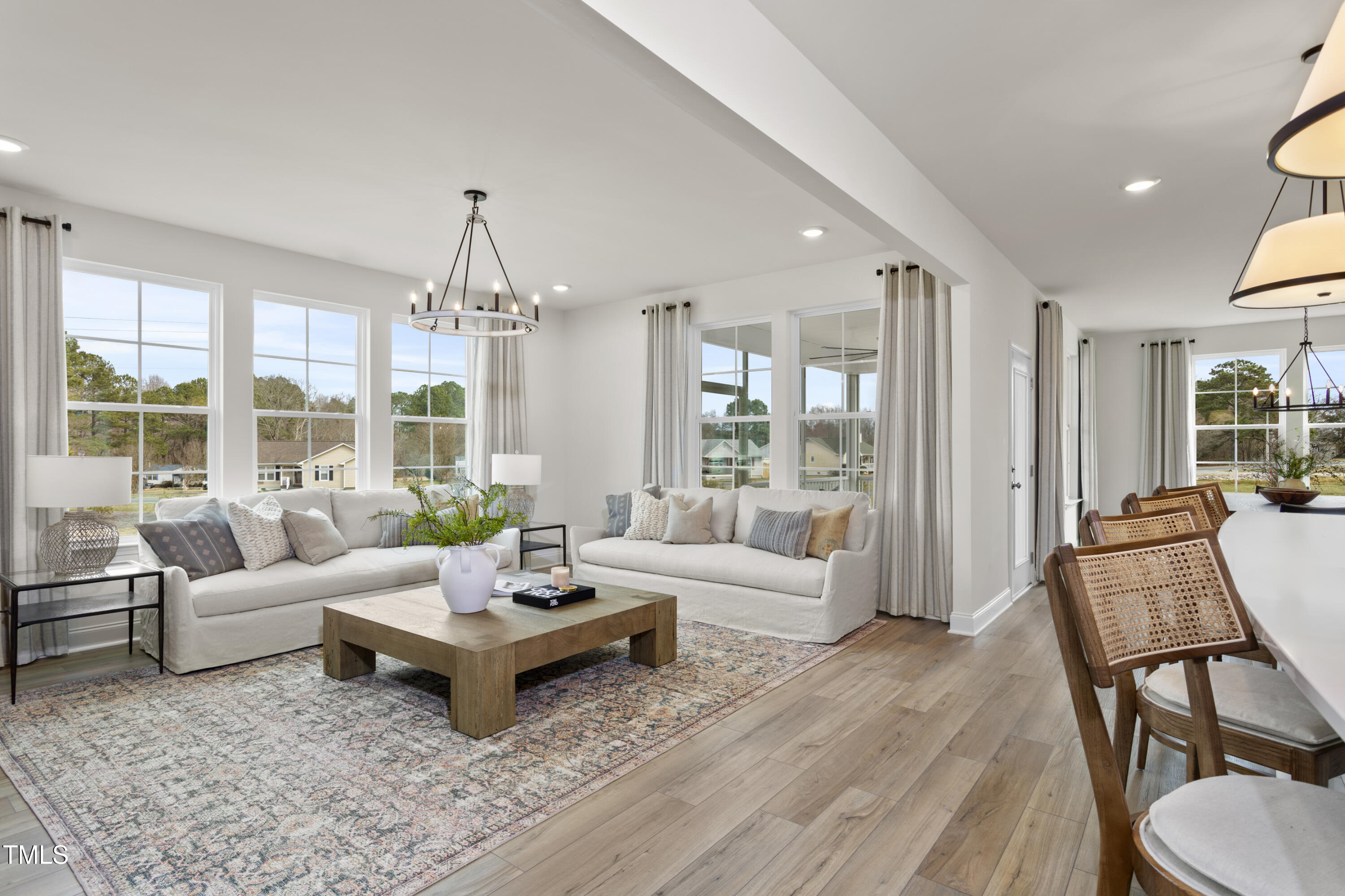 315 Adams Pointe Court Angier, NC 27501 - Photo 10 of 25 a living room with furniture or outdoor view and large windows