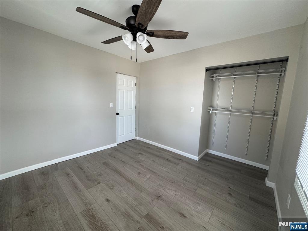 138 Carlton Avenue East Rutherford, NJ 07073 - Photo 10 of 14 a view of an empty room with wooden floor