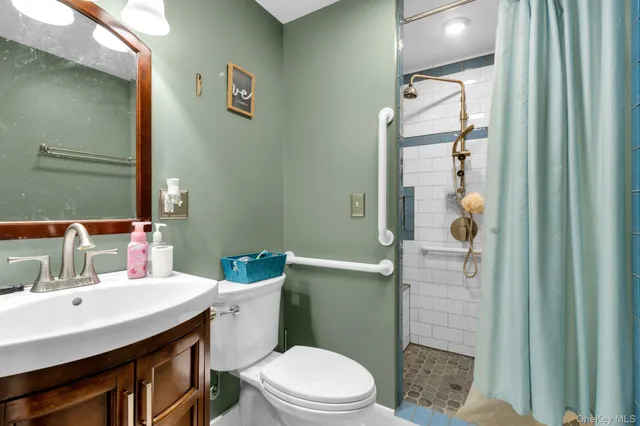 a bedroom with bed and a chandelier